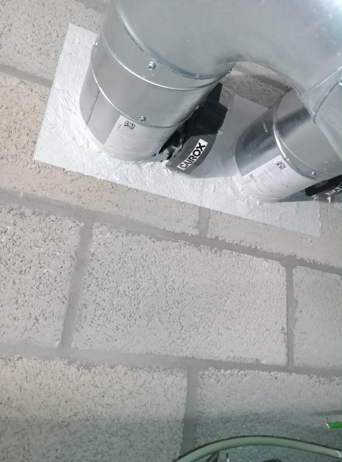 Ventilation ducts firestopped where they pass through a fire-rated wall
